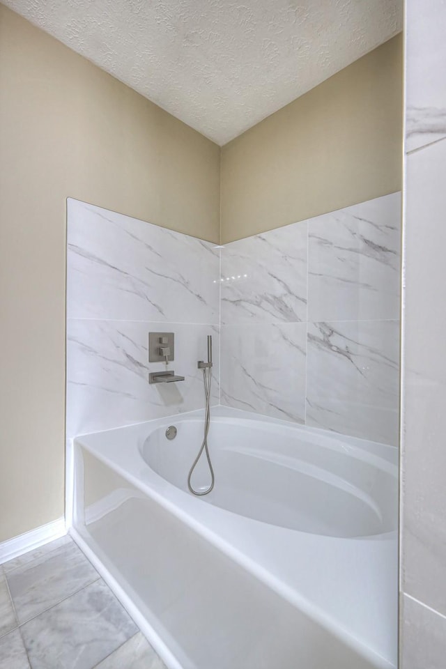 5766 Amalie Dr, Nashville, TN 37211 - bathroom with a bath and a textured ceiling