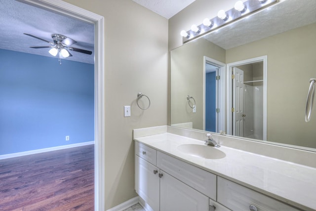 5766 Amalie Dr, Nashville, TN 37211 - bathroom with a textured ceiling, vanity, a ceiling fan, wood finished floors, and a shower
