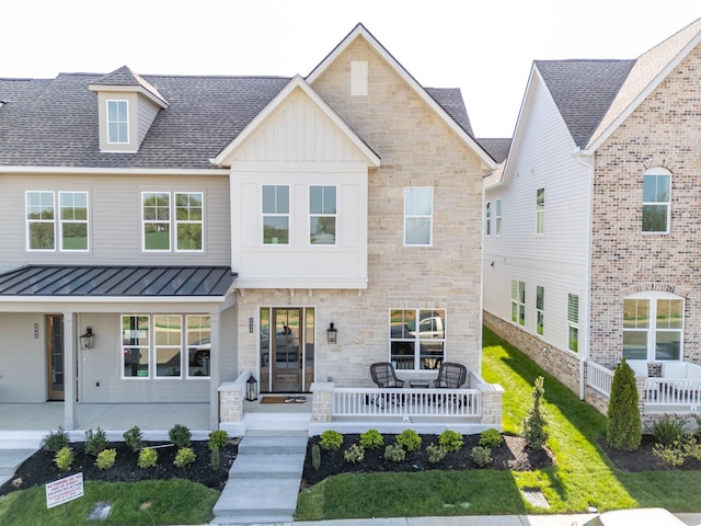 4076 Penfield Dr Unit A, Franklin, TN 37069 - view of front facade featuring stone siding, a standing seam roof, covered porch, board and batten siding, and roof with shingles