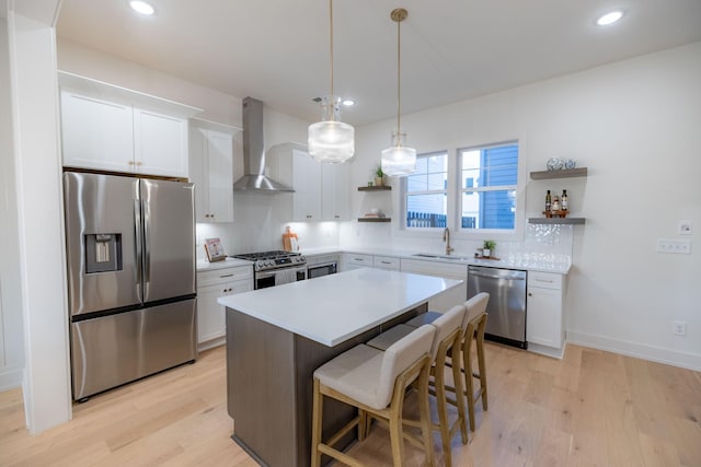 4068 Penfield Dr Unit C, Franklin, TN 37069 - kitchen with appliances with stainless steel finishes, wall chimney range hood, open shelves, light wood-style flooring, and recessed lighting