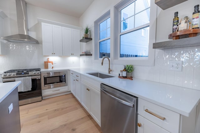 4068 Penfield Dr Unit C, Franklin, TN 37069 - kitchen featuring stainless steel appliances, wall chimney range hood, open shelves, tasteful backsplash, and white cabinets
