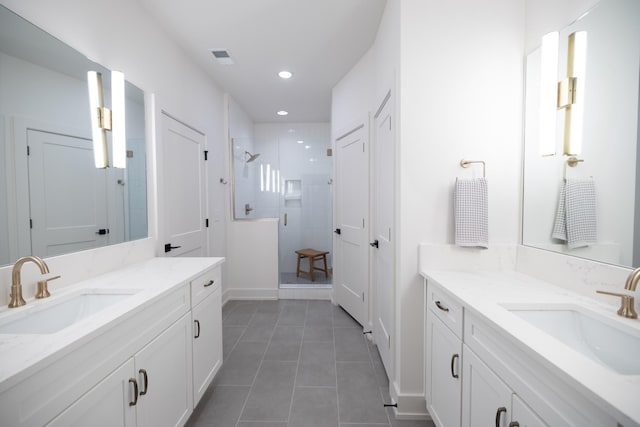 4068 Penfield Dr Unit C, Franklin, TN 37069 - full bath featuring two vanities, a stall shower, tile patterned floors, and recessed lighting