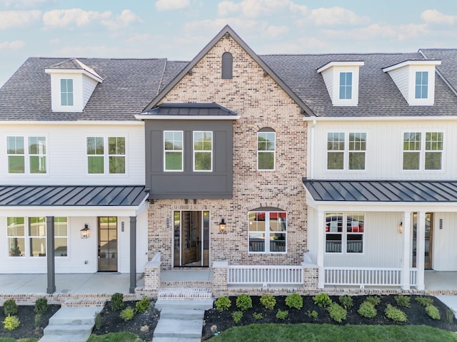 4068 Penfield Dr Unit C, Franklin, TN 37069 - modern inspired farmhouse featuring a standing seam roof, a shingled roof, and brick siding