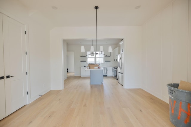4068 Penfield Dr Unit C, Franklin, TN 37069 - unfurnished living room with light wood-type flooring and a chandelier