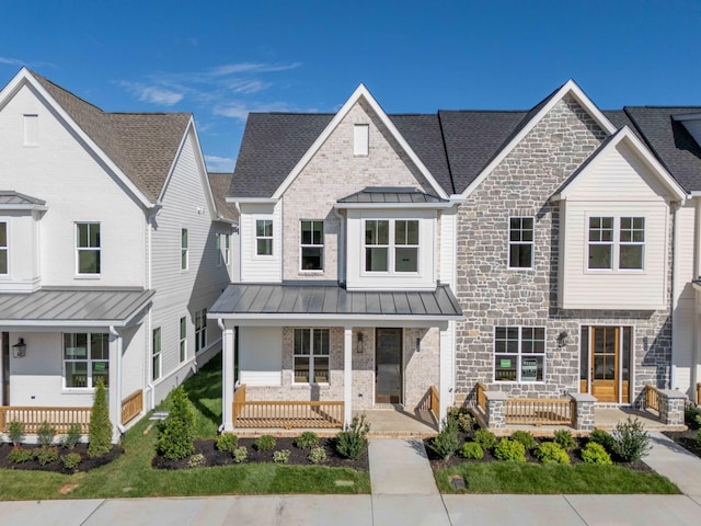 4068 Penfield Dr Unit C, Franklin, TN 37069 - view of front facade featuring a standing seam roof, covered porch, stone siding, a metal roof, and a shingled roof