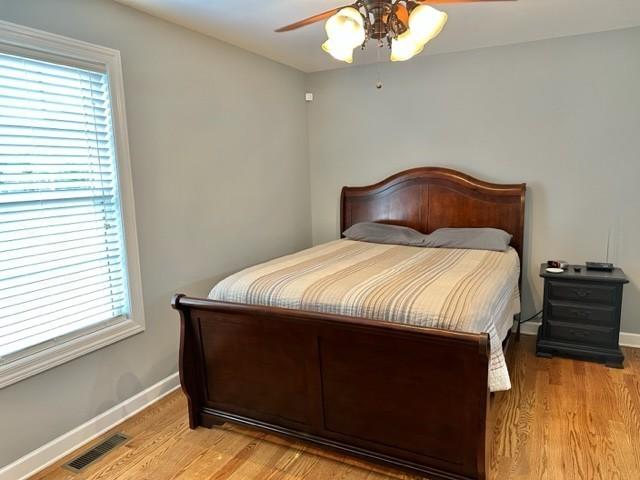 2244 Baptist Branch Rd, Mount Pleasant, TN 38474 - bedroom featuring light wood-style flooring and ceiling fan