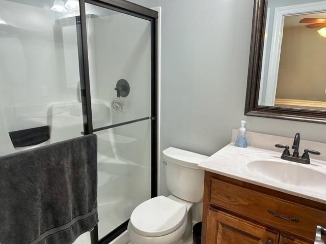 2244 Baptist Branch Rd, Mount Pleasant, TN 38474 - full bathroom with vanity, a stall shower, and ceiling fan