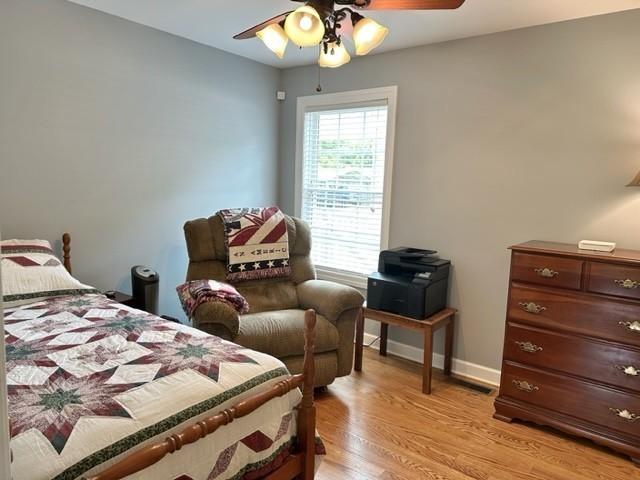 2244 Baptist Branch Rd, Mount Pleasant, TN 38474 - bedroom with light wood finished floors and a ceiling fan