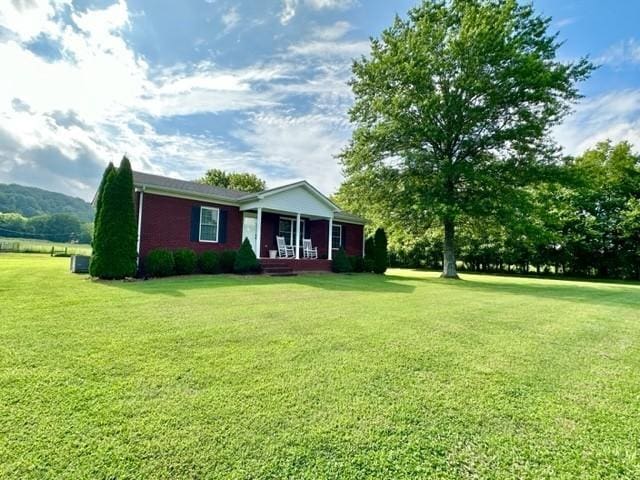 2244 Baptist Branch Rd, Mount Pleasant, TN 38474 - ranch-style house with a porch and a front yard