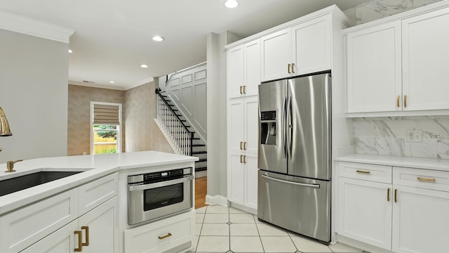 2976 Kingston Cir S, Mount Juliet, TN 37122 - kitchen with stainless steel fridge, recessed lighting, white cabinets, light countertops, and decorative backsplash