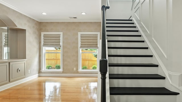 2976 Kingston Cir S, Mount Juliet, TN 37122 - stairs with wood finished floors, crown molding, arched walkways, and recessed lighting