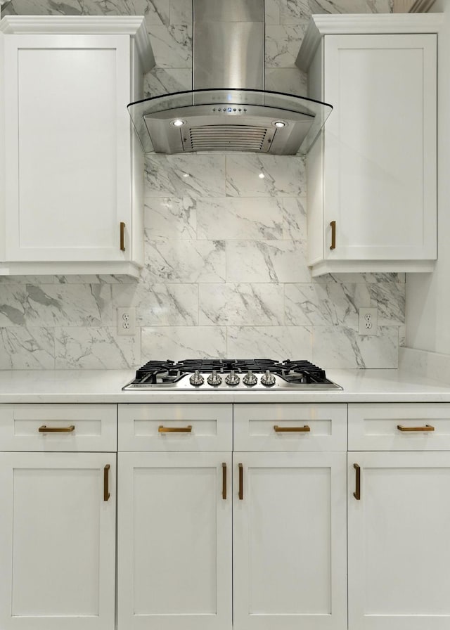 2976 Kingston Cir S, Mount Juliet, TN 37122 - kitchen with wall chimney range hood, tasteful backsplash, and white cabinetry