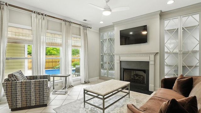 2976 Kingston Cir S, Mount Juliet, TN 37122 - living room with ornamental molding, a fireplace with flush hearth, ceiling fan, and tile patterned flooring