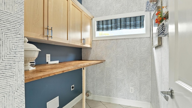 2976 Kingston Cir S, Mount Juliet, TN 37122 - laundry area featuring light tile patterned floors, cabinet space, and hookup for an electric dryer