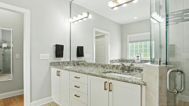 2976 Kingston Cir S, Mount Juliet, TN 37122 - full bath with double vanity, a stall shower, and wood finished floors
