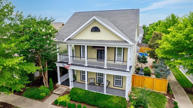 2976 Kingston Cir S, Mount Juliet, TN 37122 - view of front facade featuring a porch, a balcony, and roof with shingles