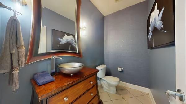 2976 Kingston Cir S, Mount Juliet, TN 37122 - bathroom featuring vanity, lofted ceiling, and tile patterned flooring