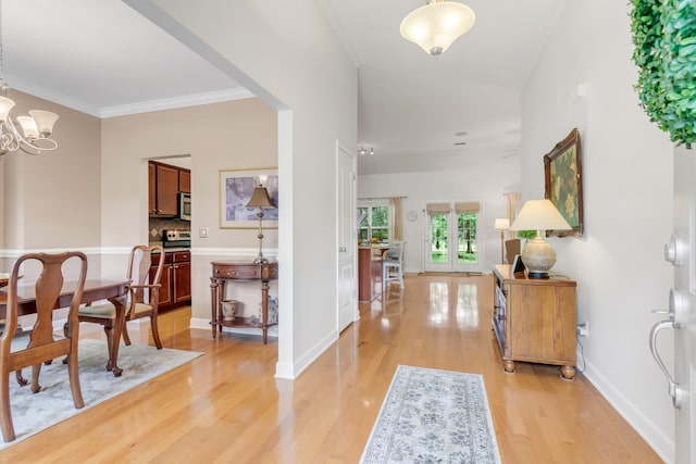 5019 John Hagar Rd, Hermitage, TN 37076 - foyer featuring light wood-style floors, a chandelier, and ornamental molding