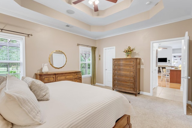 5019 John Hagar Rd, Hermitage, TN 37076 - bedroom featuring multiple windows, light colored carpet, and a raised ceiling