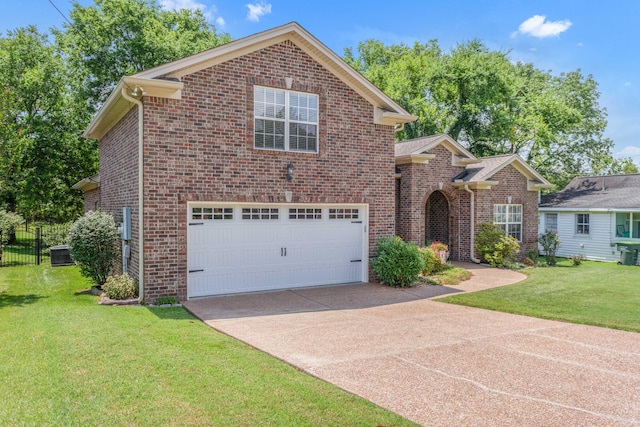 5019 John Hagar Rd, Hermitage, TN 37076 - traditional home with an attached garage, driveway, and brick siding