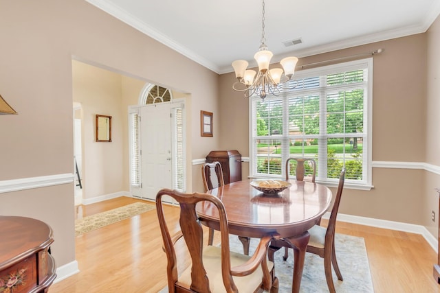 5019 John Hagar Rd, Hermitage, TN 37076 - dining area featuring a chandelier, light wood finished floors, and ornamental molding