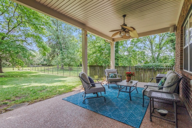 5019 John Hagar Rd, Hermitage, TN 37076 - fenced backyard featuring a patio, a ceiling fan, view of scattered trees, and outdoor lounge area