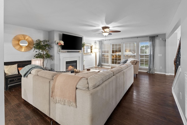 2684 Wind Dance Ct, Spring Hill, TN 37174 - living room with a glass covered fireplace, ceiling fan, and dark wood finished floors
