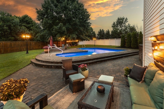 2684 Wind Dance Ct, Spring Hill, TN 37174 - pool at dusk with a patio area and a fenced backyard