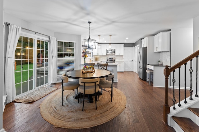 2684 Wind Dance Ct, Spring Hill, TN 37174 - dining room with stairway, dark wood-type flooring, recessed lighting, and a chandelier