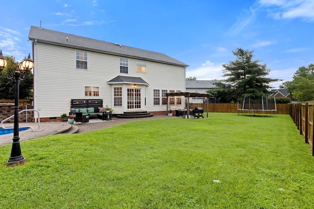 2684 Wind Dance Ct, Spring Hill, TN 37174 - back of property with a trampoline, a patio, and a fenced backyard