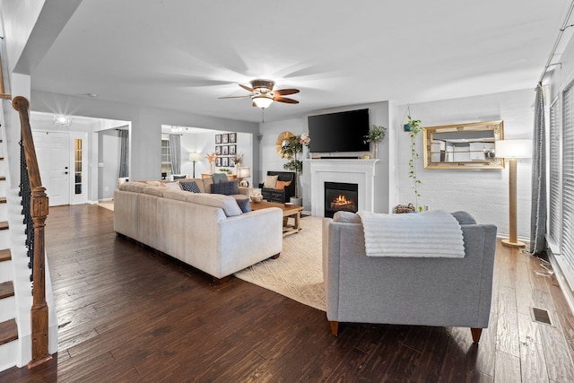 2684 Wind Dance Ct, Spring Hill, TN 37174 - living area featuring stairs, ceiling fan, hardwood / wood-style flooring, and a lit fireplace