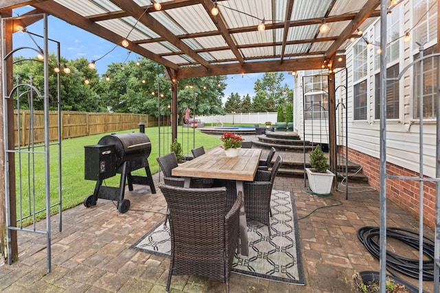 2684 Wind Dance Ct, Spring Hill, TN 37174 - fenced backyard with a patio and outdoor dining space