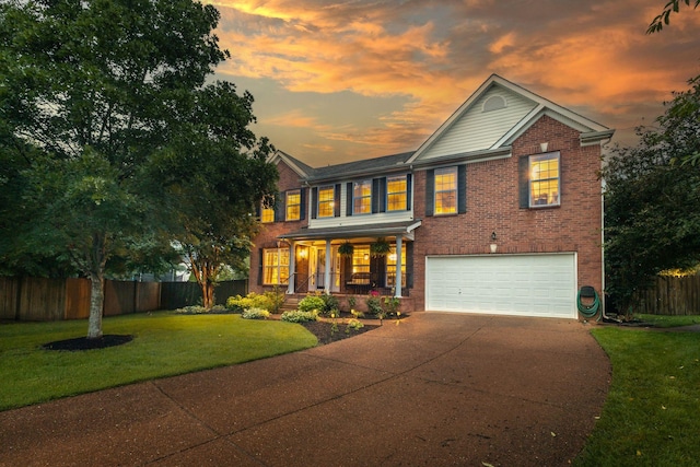 2684 Wind Dance Ct, Spring Hill, TN 37174 - view of front of property with an attached garage, driveway, covered porch, and brick siding