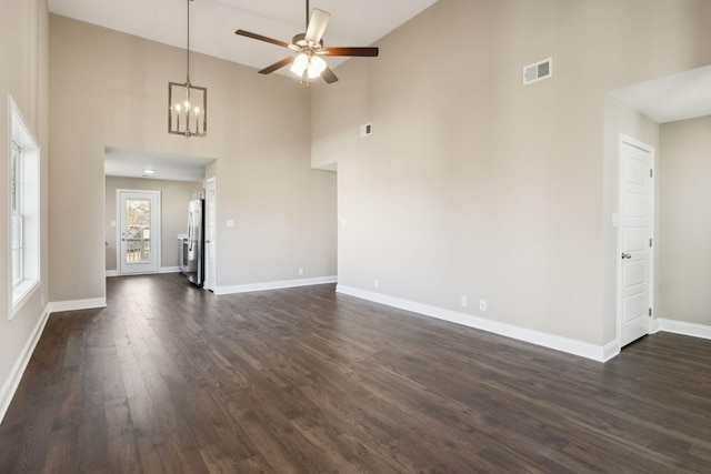 413 Stein St, Oak Grove, KY 42262 - unfurnished living room with high vaulted ceiling, a ceiling fan, a chandelier, and dark wood-type flooring