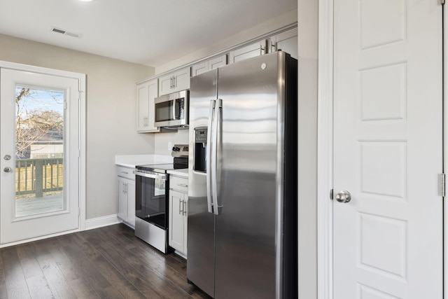 413 Stein St, Oak Grove, KY 42262 - kitchen featuring stainless steel appliances, light countertops, and dark wood-style flooring