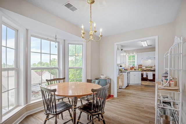 2106 Debbie Ln, La Vergne, TN 37086 - dining area with light wood finished floors and a chandelier