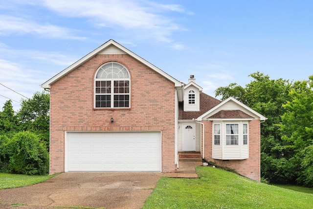 2106 Debbie Ln, La Vergne, TN 37086 - traditional-style home featuring a garage, asphalt driveway, brick siding, a front yard, and a chimney