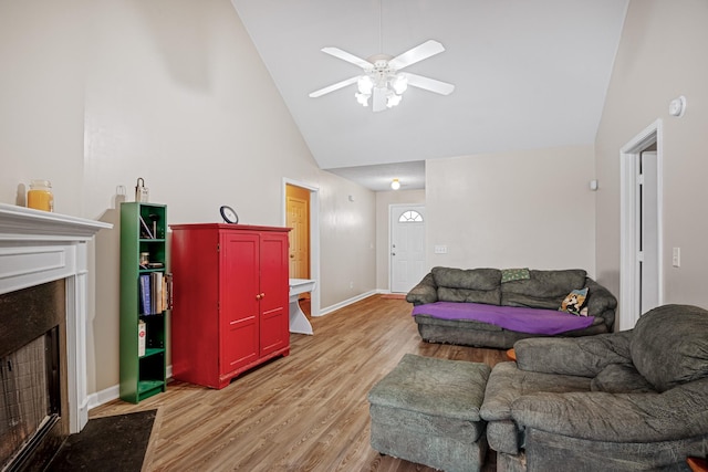 2106 Debbie Ln, La Vergne, TN 37086 - living area with a premium fireplace, light wood-type flooring, ceiling fan, and high vaulted ceiling