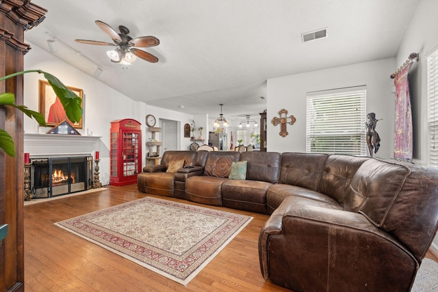 1857 Brookmeadow Ln, Hermitage, TN 37076 - living area featuring ceiling fan, wood finished floors, and a glass covered fireplace