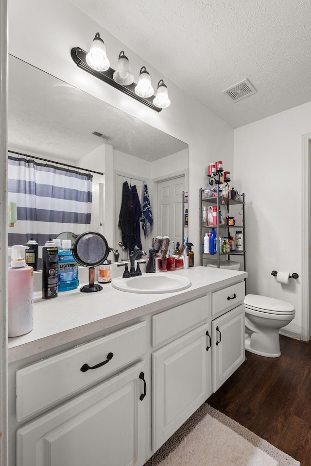 1857 Brookmeadow Ln, Hermitage, TN 37076 - bathroom with vanity, wood finished floors, a textured ceiling, and curtained shower