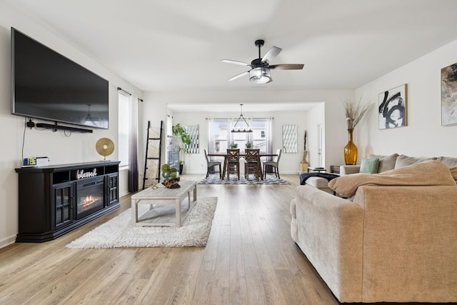 809 Old Blue Ln, Murfreesboro, TN 37130 - living room with ceiling fan, a glass covered fireplace, and wood finished floors