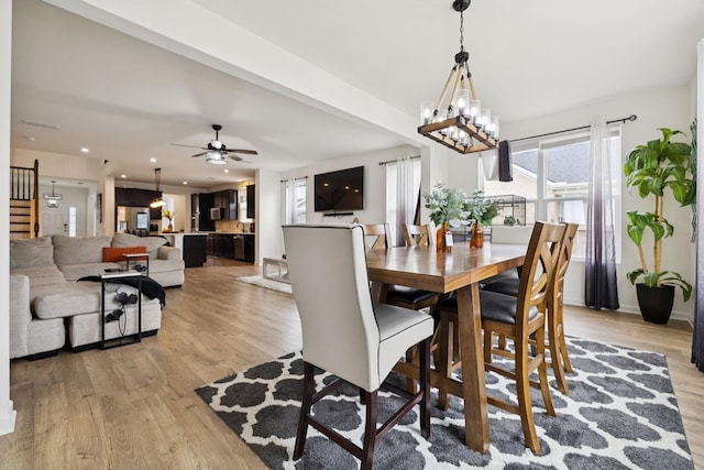 809 Old Blue Ln, Murfreesboro, TN 37130 - dining space with light wood finished floors, a ceiling fan, and a chandelier