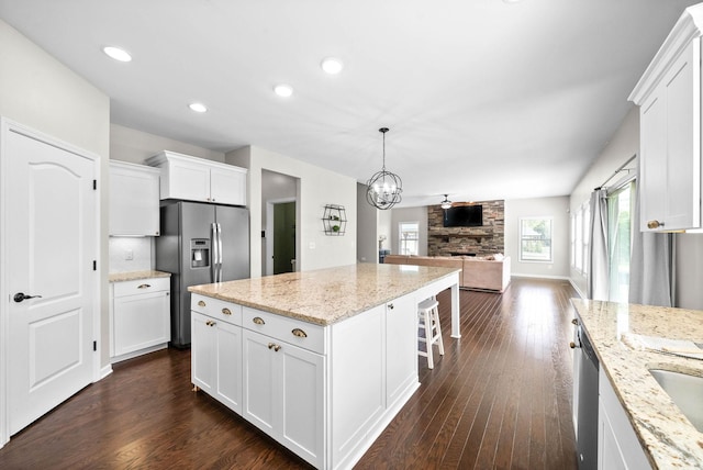 1197 Upland Ter, Clarksville, TN 37043 - kitchen with appliances with stainless steel finishes, open floor plan, dark wood-style flooring, white cabinets, and recessed lighting