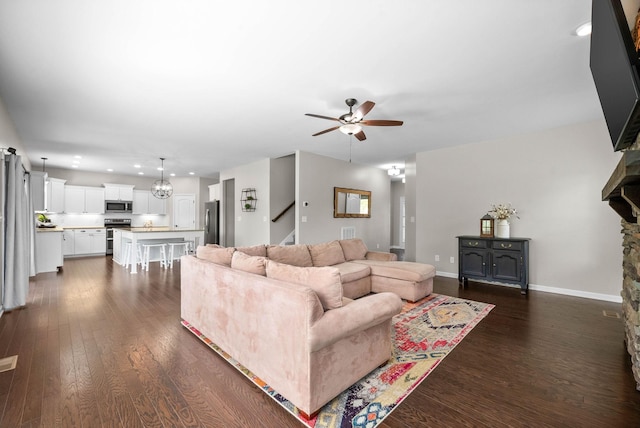 1197 Upland Ter, Clarksville, TN 37043 - living room with a ceiling fan, dark wood-style floors, recessed lighting, and stairway