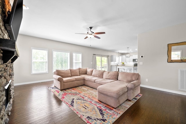 1197 Upland Ter, Clarksville, TN 37043 - living room featuring a stone fireplace, a ceiling fan, dark wood finished floors, and recessed lighting