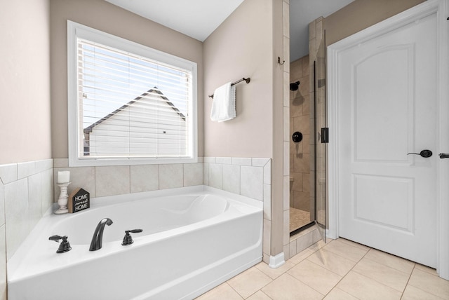 1197 Upland Ter, Clarksville, TN 37043 - bathroom featuring a bath, a shower stall, and tile patterned flooring