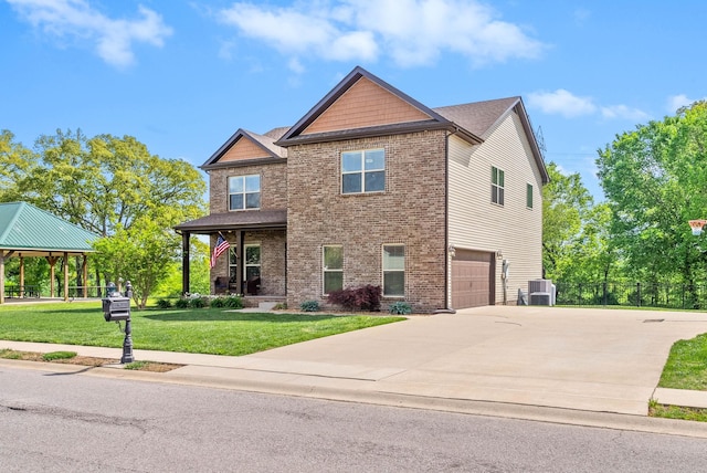 1197 Upland Ter, Clarksville, TN 37043 - craftsman inspired home with a gazebo, a front yard, brick siding, driveway, and a garage
