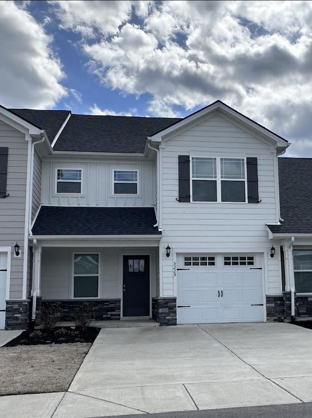 5225 Normandy Cob Dr Unit 33, Murfreesboro, TN 37129 - view of front of home with driveway, stone siding, and an attached garage