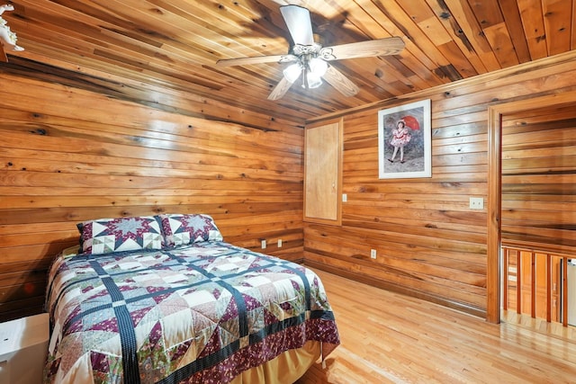 1880 Clydeton Rd, Waverly, TN 37185 - bedroom featuring wood ceiling, wooden walls, wood finished floors, a relaxing sauna, and ceiling fan
