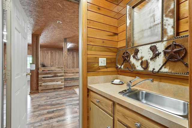1880 Clydeton Rd, Waverly, TN 37185 - kitchen with wood finished floors, light countertops, and wooden walls